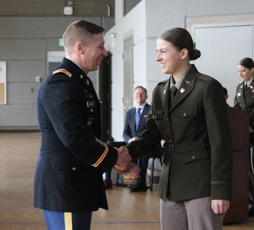 Cadet shaking hands after commissioning