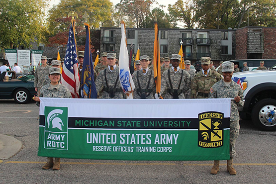 cadets holding banner in parade